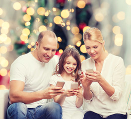 happy family with smartphones