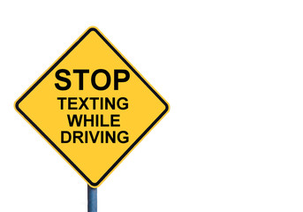 Yellow roadsign with STOP TEXTING WHILE DRIVING message