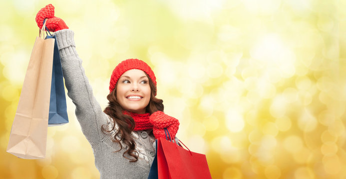 Happy Woman In Winter Clothes With Shopping Bags