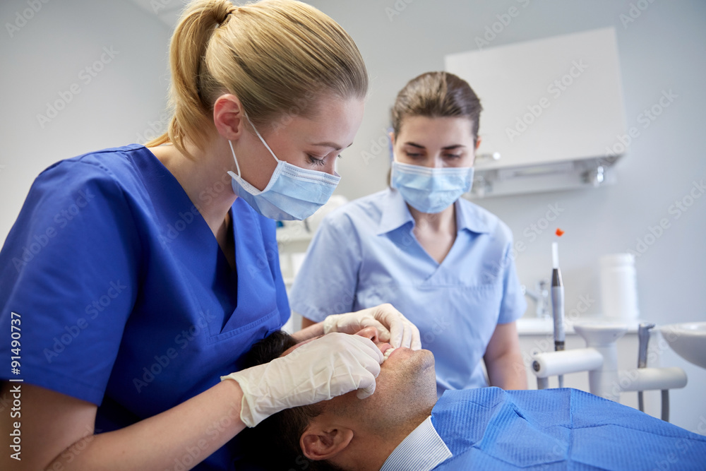 Sticker female dentist checking patient dental occlusion