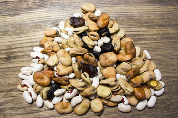 different haricot beans on the wooden table