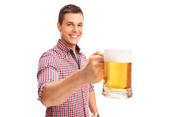 Joyful man holding a large beer mug