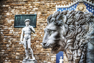 lion head statue in Lanzi della Loggia with Michelangelo's David