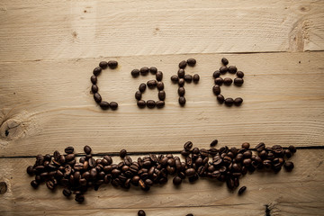 Scritta caffè con chicchi di caffè