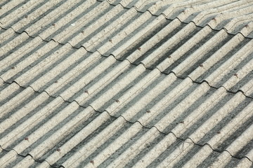 Old grey waved asbestos roof 