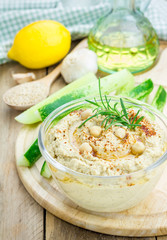 Bowl of classic hummus sprinkled with paprika and sesame