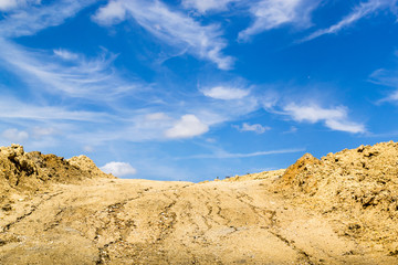 Fototapeta na wymiar Excavated Mud and Blue Sky