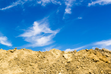 Fototapeta na wymiar Excavated Mud and Blue Sky