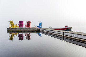 Colorful Muskoka Chairs on a Dock