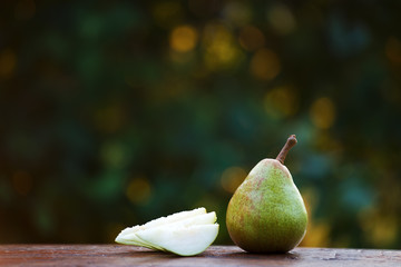 Delicious organic pear on rustic wood