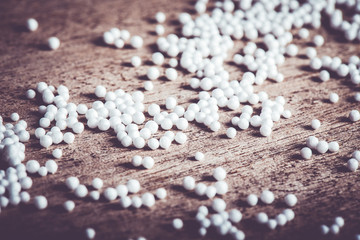 Pieces of foam plastic like snow balls on the background of the