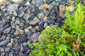 Close-rock dam with blurred grass.