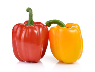 colored peppers over white background