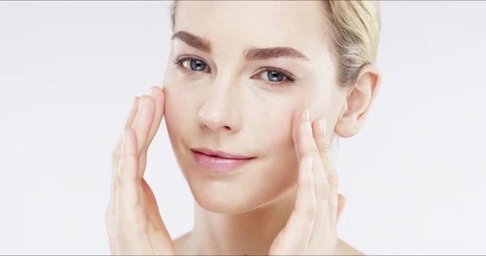 Closeup portrait of beautiful woman touching face slow motion skincare concept - Red Epic Dragon