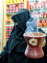 A woman selling frankincense at the Souq Al Hasn, Salalah, Dhofar Governorate, Sultanate of Oman
