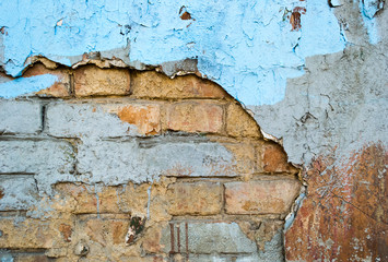 Obraz premium Brick wall with cracks and an old plaster as background