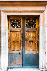 Old wooden door with metal handle