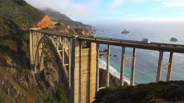 Establishing shot of the famous Bixby Bridge on California's Highway One near Big Sur.
