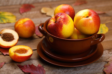 close up of ripe peaches on a wooden background
