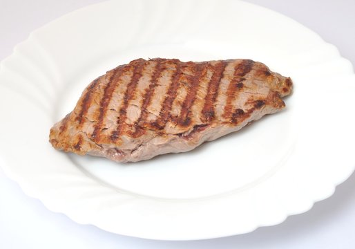 Grilled beef steak on plate