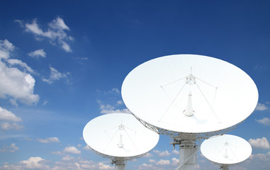 satellite dish antennas with blue sky