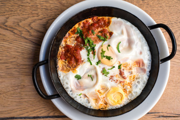 Oriental omelette  in a tomato paprika ragout with fresh herbs