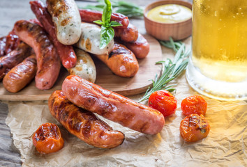 Grilled sausages with glass of beer