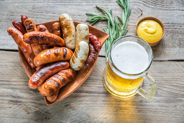 Grilled sausages with glass of beer