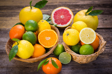 Fresh and juicy citrus fruits in the basket 