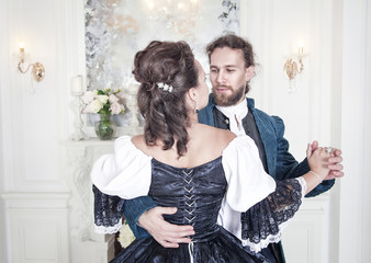 Beautiful couple woman and man in medieval clothes