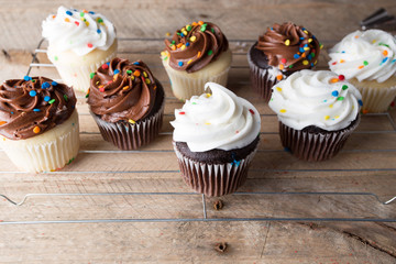 Homemade white and chocolate cupcakes.