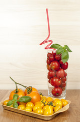 red tomato cocktail wit basil and yellow tomatoes