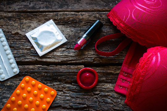 bra and contraception on a wooden background