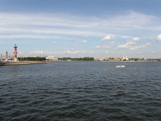 View at the Admiralty across Neva River and Rostral Columns at the Spit of Vasilievsky Island in Saint Petersburg, Russia
