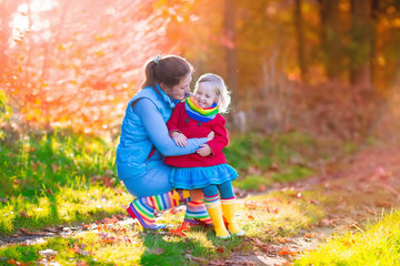 Fototapeta premium Family walking in autumn park