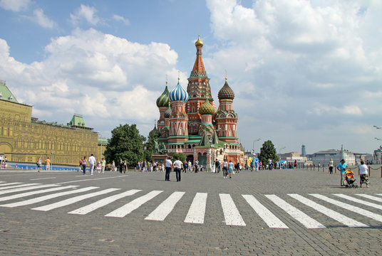 MOSCOW, RUSSIA - JUNE 11, 2010: Pedestrian crossing in front of St. Basil's Cathedral on Red Square, Moscow.