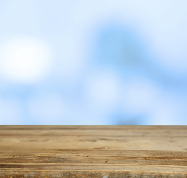 Wooden table  with abstract  blur background