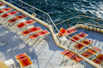 orange sunbeds at a terrace at the Corniche in Marseille