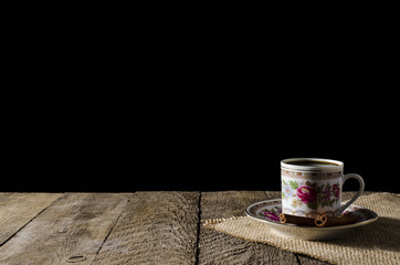 Porcelain coffee cup on wooden table