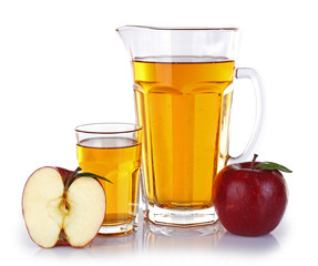 Full jug and glass of apple juice with fruit isolated on white