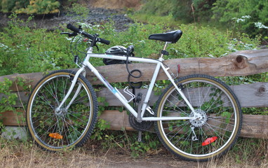 Fototapeta na wymiar Bike on split rail wooden Fence