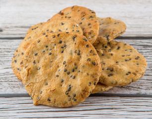 Japanese rice crackers, locally known as senbei over wooden background
