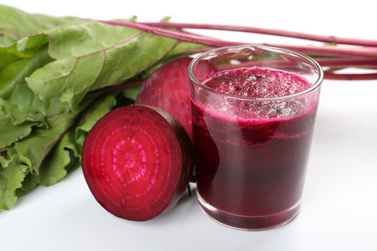 Glass of beet juice with vegetables close up