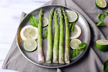 Fresh asparagus on pan, close-up
