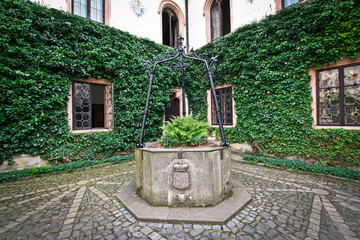 Old well in the courtyard of the Sychrov castle