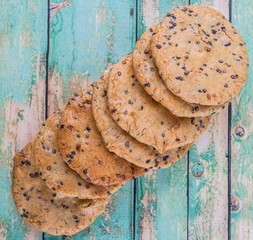 Japanese rice crackers, locally known as senbei over wooden background
