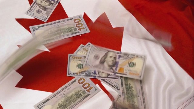 canadian flag and lots of hundred dollar bills