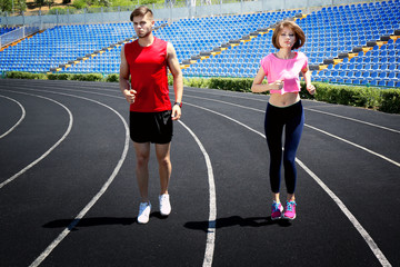 Obraz premium Young people jogging on stadium
