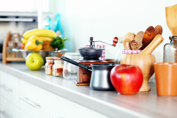 Composition with different utensils on wooden wooden table in kitchen