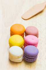Macarons buttercream on the old  wood.